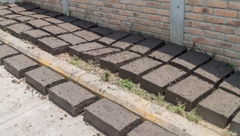 abobe bricks laid out on a pavement