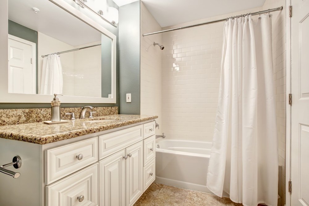 white bathroom with vanity shower curtain
