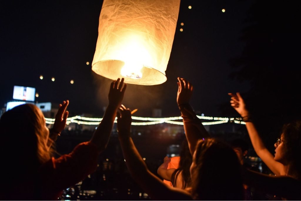 a company of friends launches a sky lantern