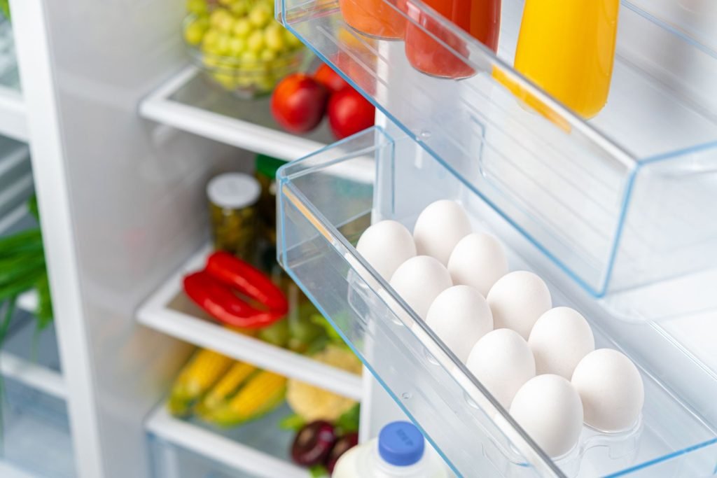 pack of eggs on a fridge shelf
